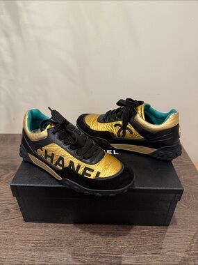 CHANEL Black & Gold Logo Low-Top Sneakers. Limited edition. Authentic